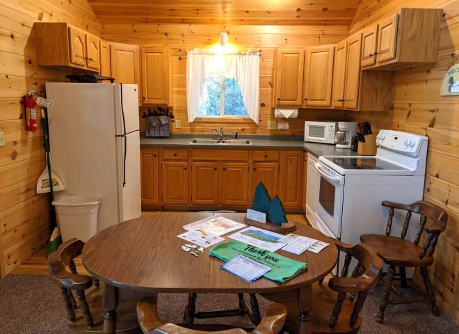 Kitchen with a refrigerator, stove, and dishwasher.