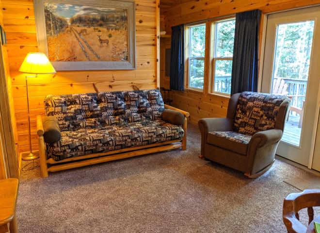 Living room with futon and chair.