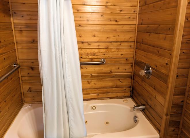 Bathroom with a whirlpool tub/shower.