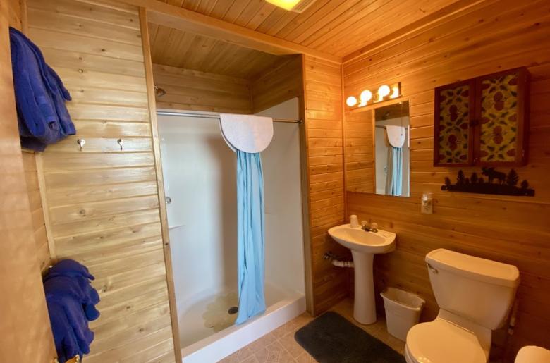 Bathroom with an easy access sink and shower stall.