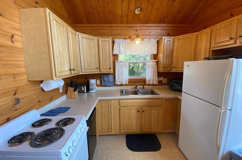 Kitchen with a refrigerator, stove, and dishwasher.