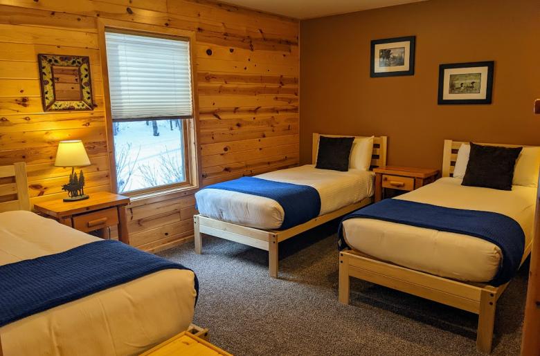 Main floor bedroom with two XL twins and one regular twin.