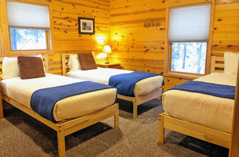 Master bedroom with two XL twins, one regular twin, and an ensuite bathroom.