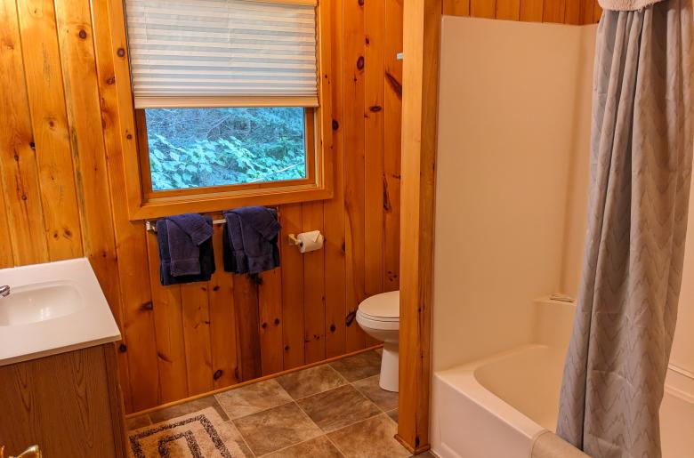 Upstairs bathroom with a standard tub/shower.