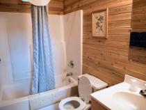 Bathroom with a standard tub/shower.