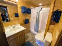 Bathroom with an oversized shower stall.