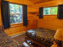 Bedroom with a full size bed, twin bed, lofted twin bed, and a ensuite bathroom.