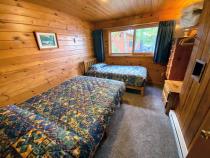 Bedroom with a full size bed and twin.