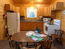 Kitchen with a refrigerator, stove, and dishwasher.