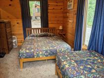 Bedroom with a queen and twin bed.