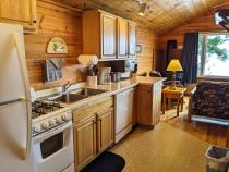 Kitchen with a refrigerator, stove, and dishwasher.