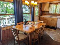Dining room with seating for 6 and views of the lake.