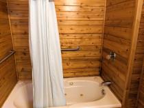 Bathroom with a whirlpool tub/shower.