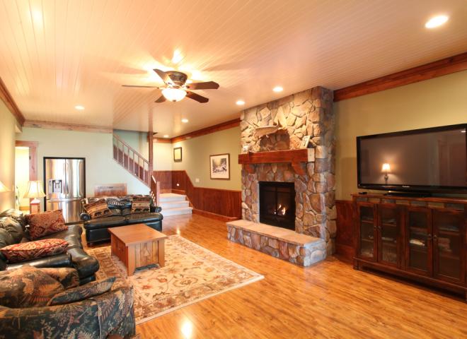 Downstairs living room showing extra fridge and desk space.