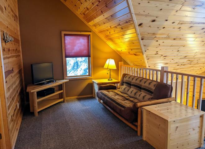 Loft area with a futon.