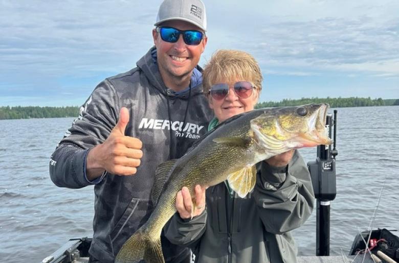 Pehrson Lodge guide, Jason Freed, with client and large Walleye